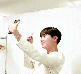 GIF: JHope is taking selfies!